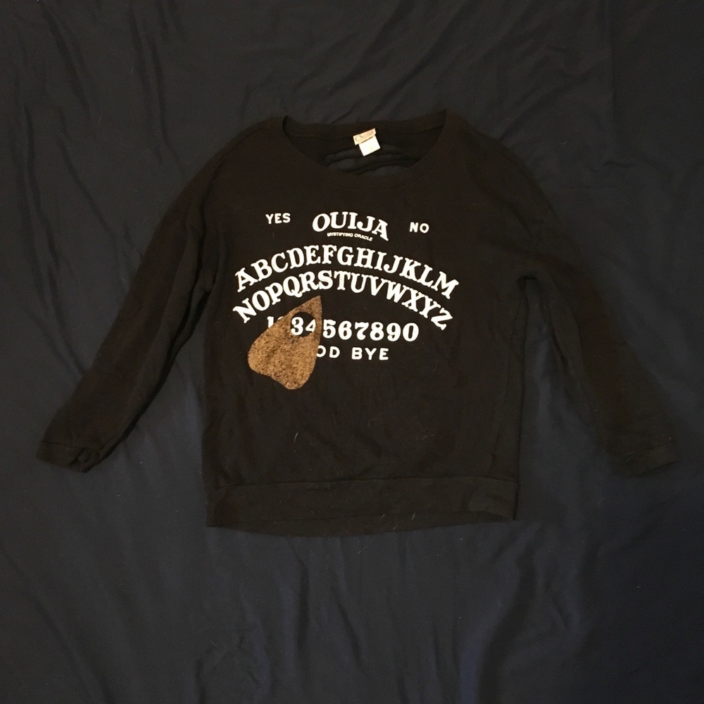 Ouija board sweater with cut open back